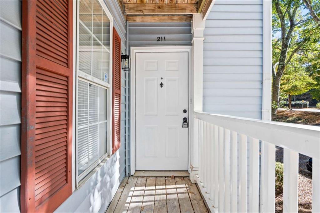 211 Cobblestone Trail Avondale Estates, GA 30002 - Photo 2 of 19 a view of a front door and wooden floor