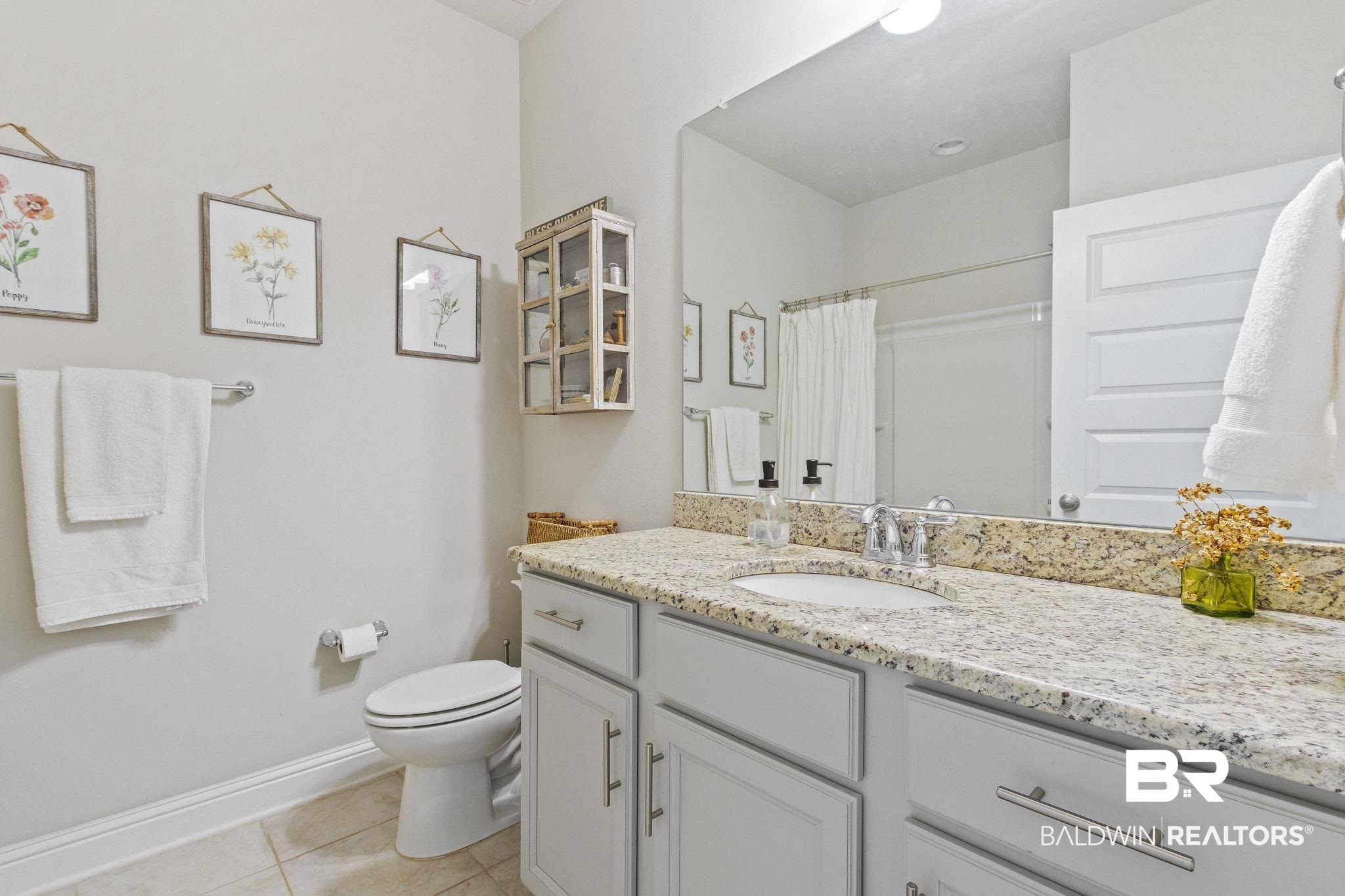 31663 Kestrel Loop Daphne, AL 36527 - Photo 44 of 86 Bathroom featuring tile patterned flooring, vanity, toilet, and a shower with curtain