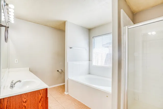 a white bath tub sitting next to a white sink