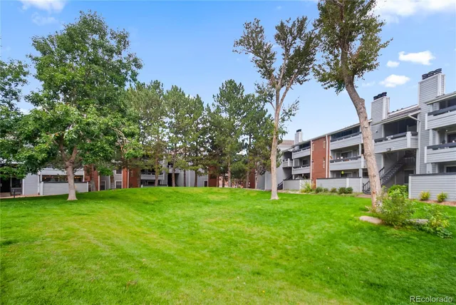 a view of a building with a yard
