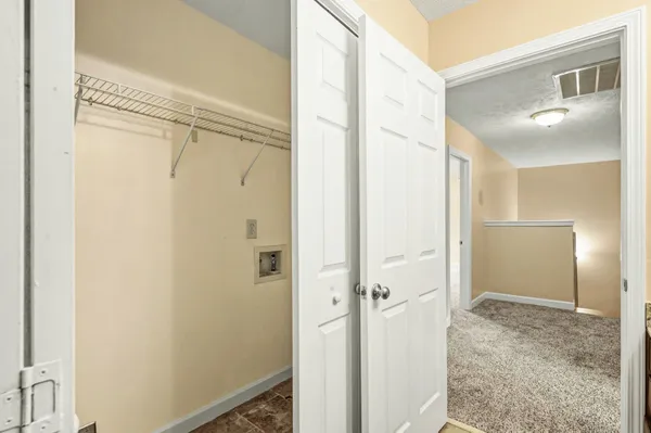 a bathroom with a shower and a glass door