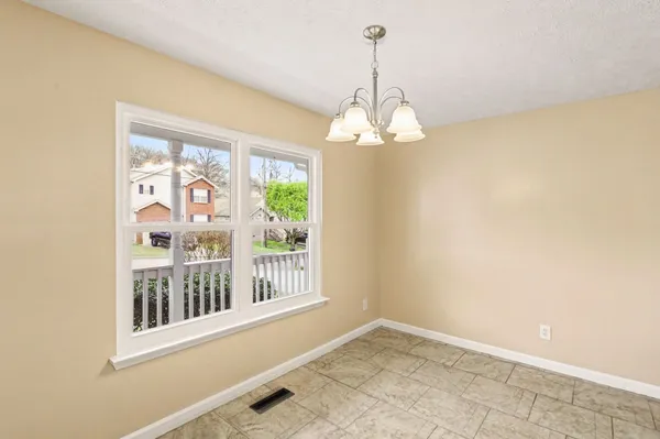 a view of a big room with windows