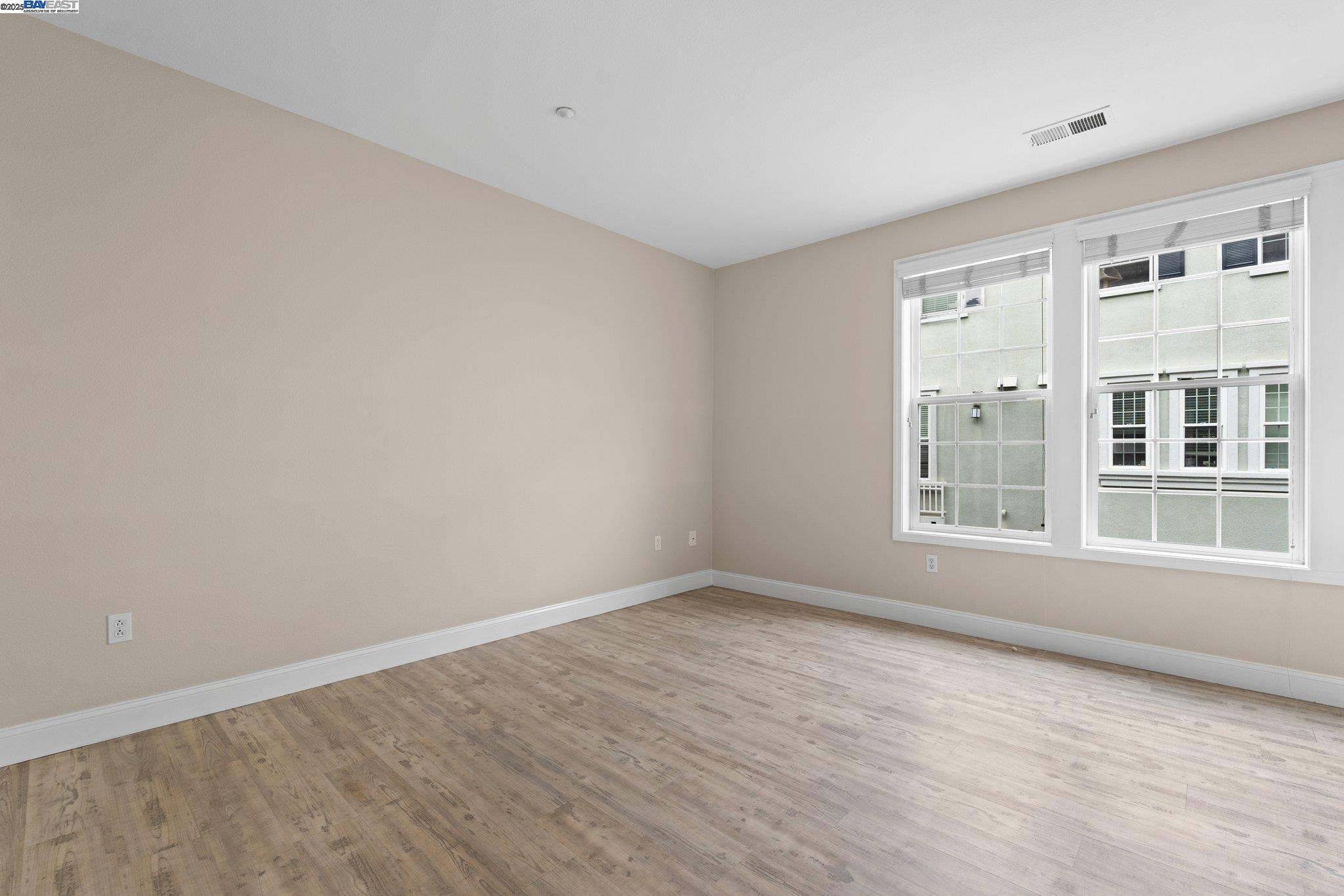 3658 Whitworth Drive Dublin, CA 94568 - Photo 11 of 36 wooden floor in an empty room with a window