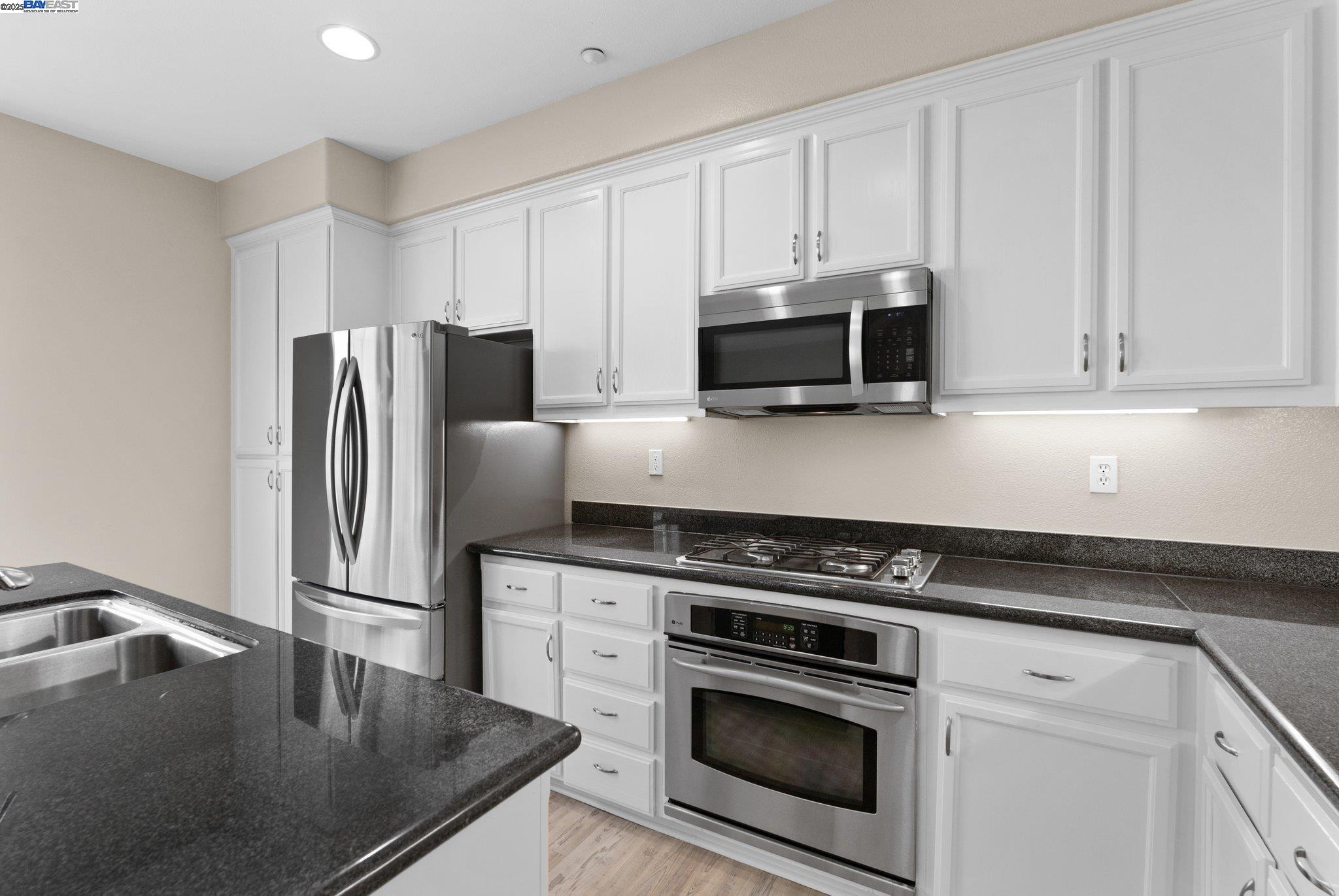 3658 Whitworth Drive Dublin, CA 94568 - Photo 15 of 36 a kitchen with appliances a sink and cabinets