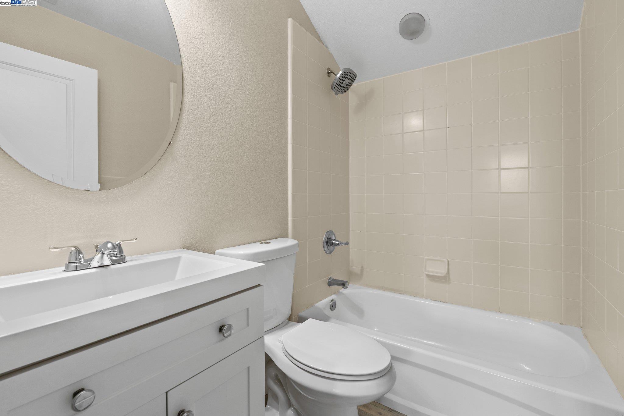 3658 Whitworth Drive Dublin, CA 94568 - Photo 18 of 36 a bathroom with a sink a toilet and a mirror