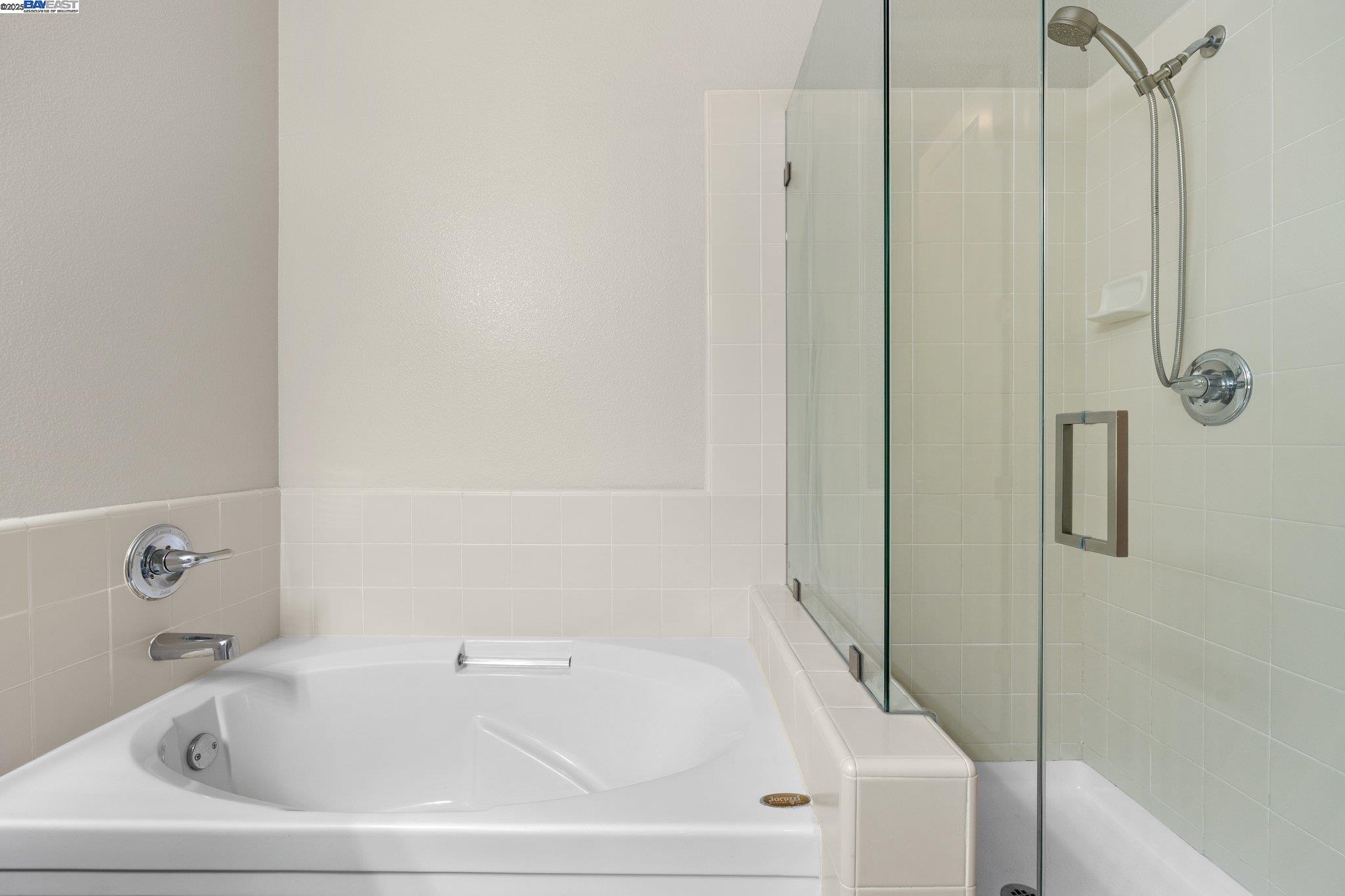 3658 Whitworth Drive Dublin, CA 94568 - Photo 21 of 36 a white bath tub sitting next to a white sink and a shower