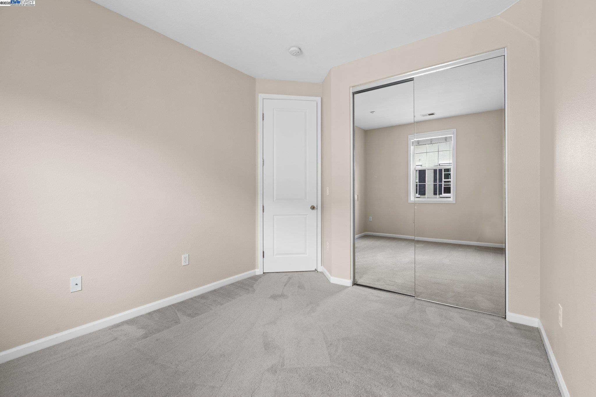 3658 Whitworth Drive Dublin, CA 94568 - Photo 22 of 36 an empty room with a bathroom and mirror