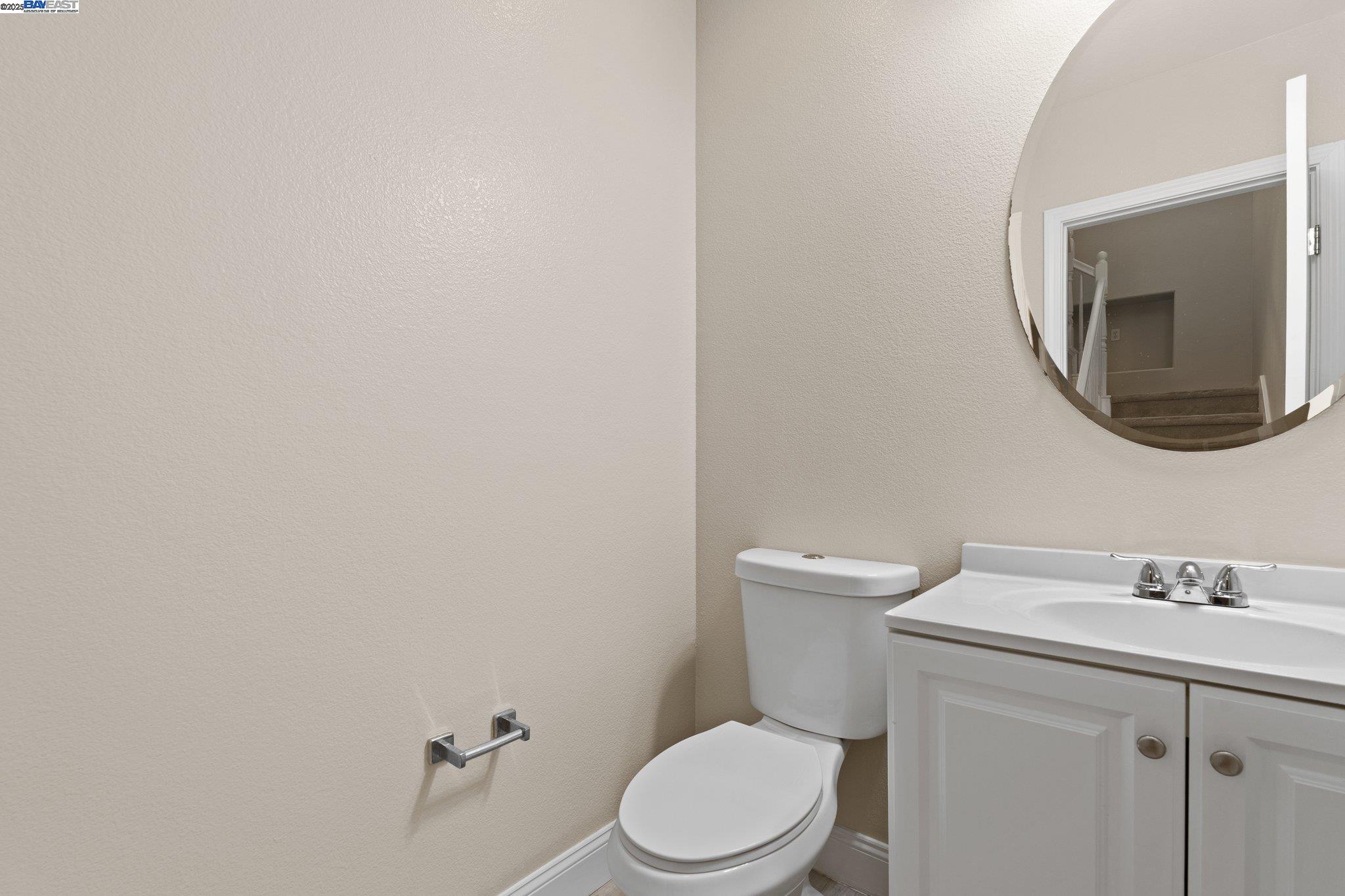 3658 Whitworth Drive Dublin, CA 94568 - Photo 31 of 36 a white toilet sitting next to a bathroom sink