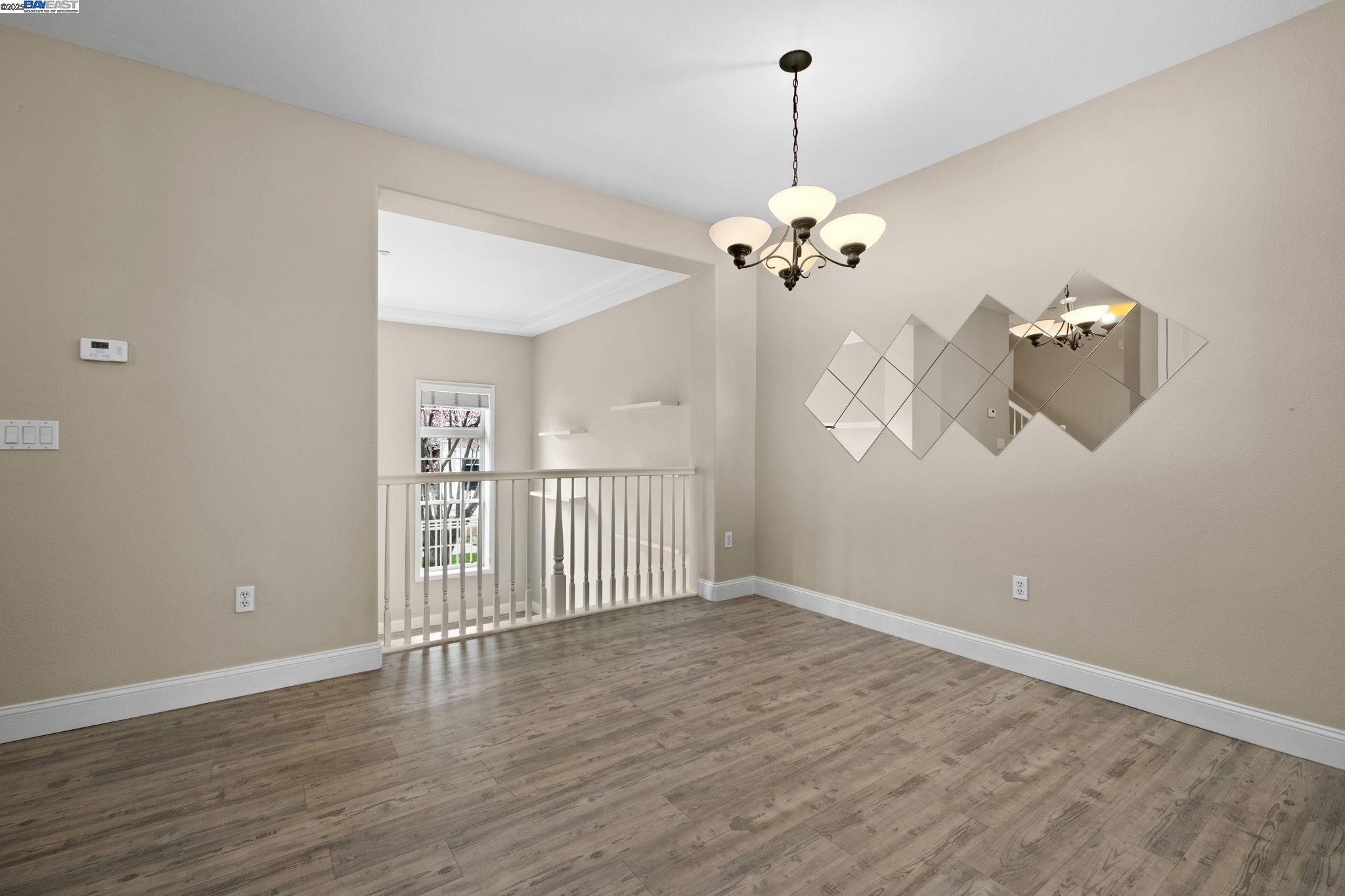3658 Whitworth Drive Dublin, CA 94568 - Photo 10 of 36 a view of a room with wooden floor and ceiling fan