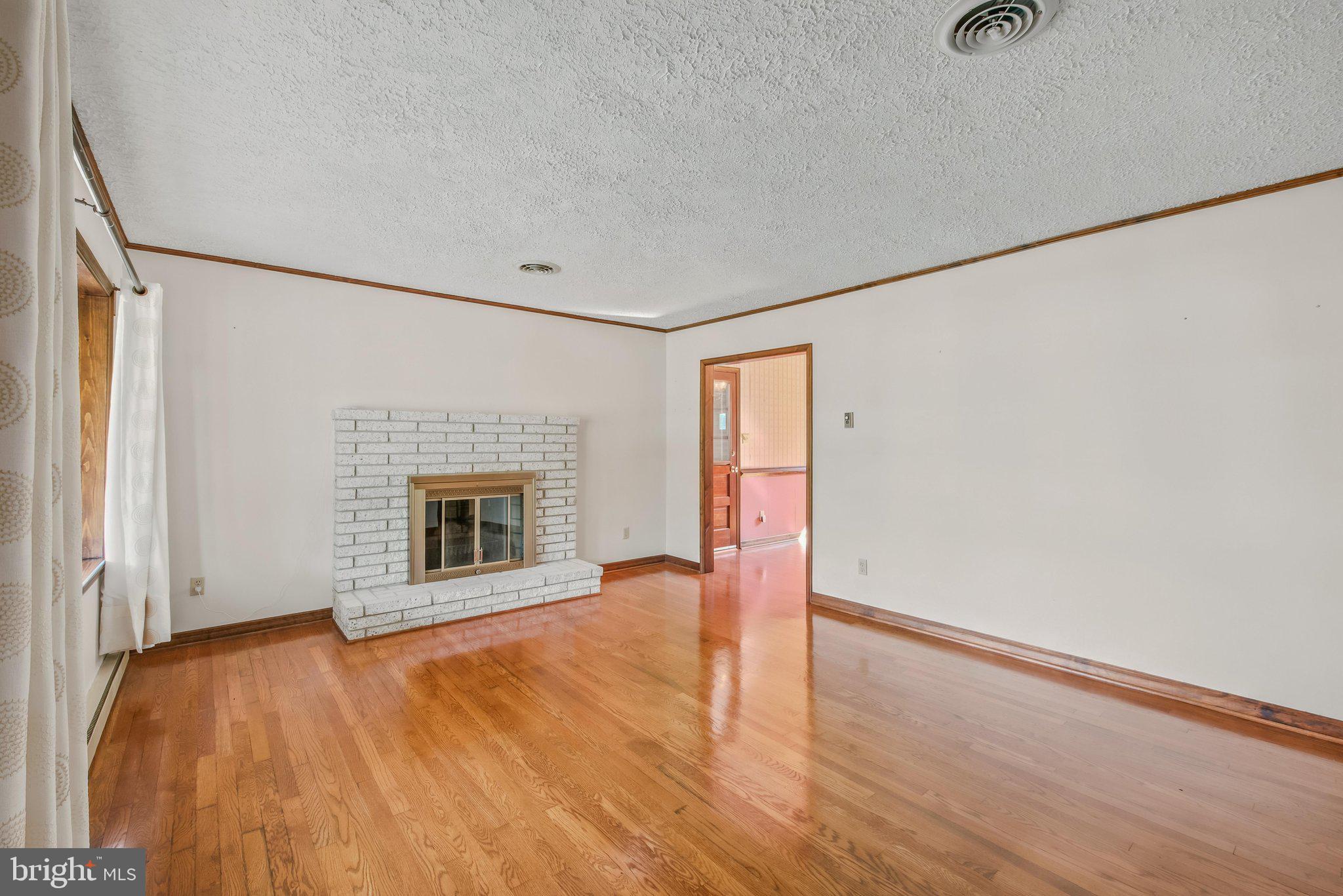 3203 Charles Town Road Kearneysville, WV 25430 - Photo 8 of 45 and woodburning fireplace with raised hearth