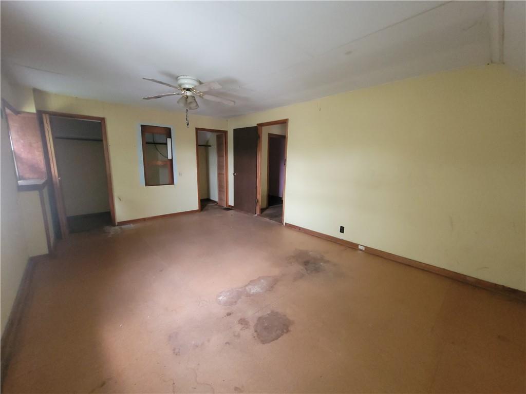 3013 Leechburg Road New Kensington, PA 15068 - Photo 11 of 28 an empty room with chandelier fan and windows