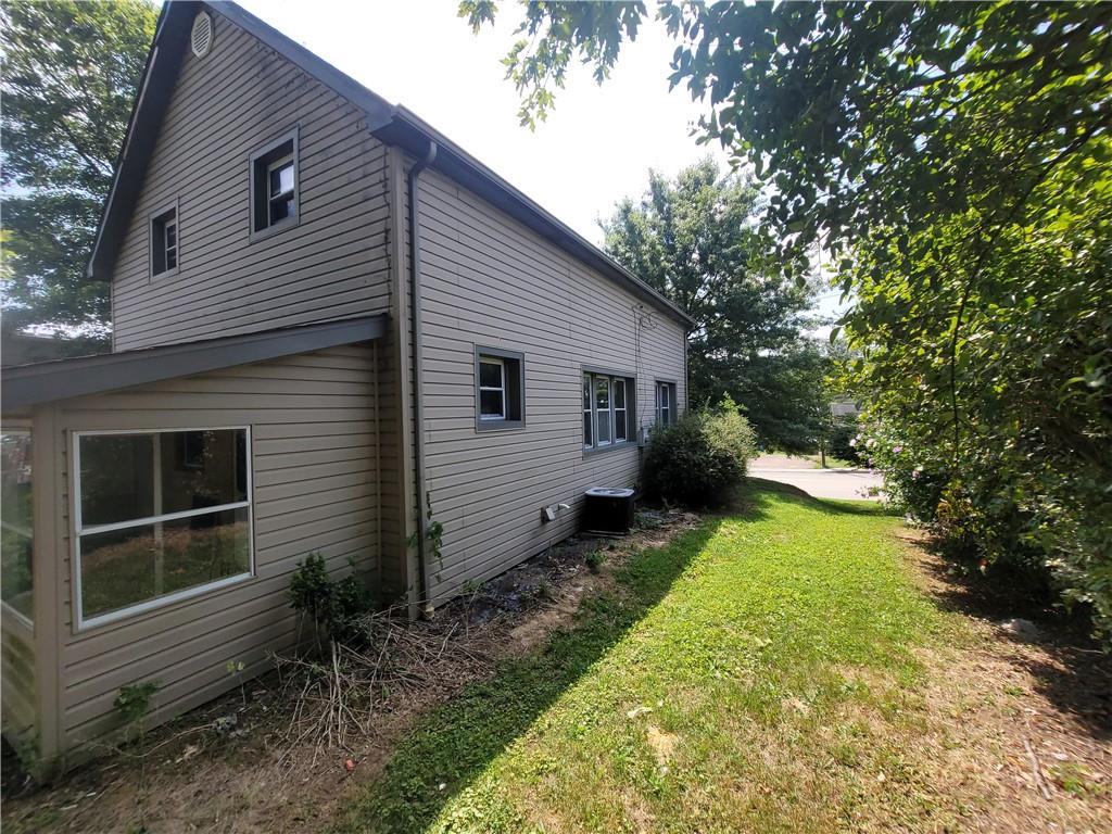 3013 Leechburg Road New Kensington, PA 15068 - Photo 26 of 28 a view of backyard with potted plants and a large tree