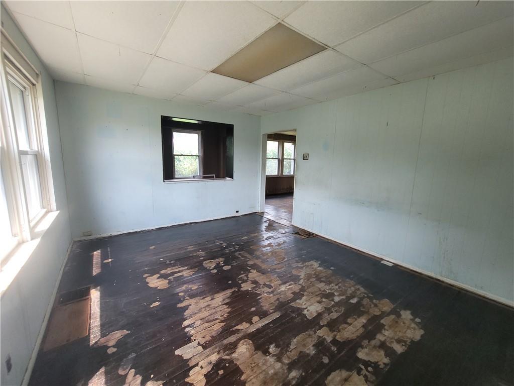 3013 Leechburg Road New Kensington, PA 15068 - Photo 3 of 28 an empty room with wooden floor and windows