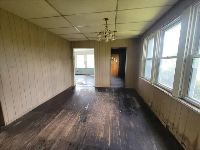 a view of gallery with wooden floor