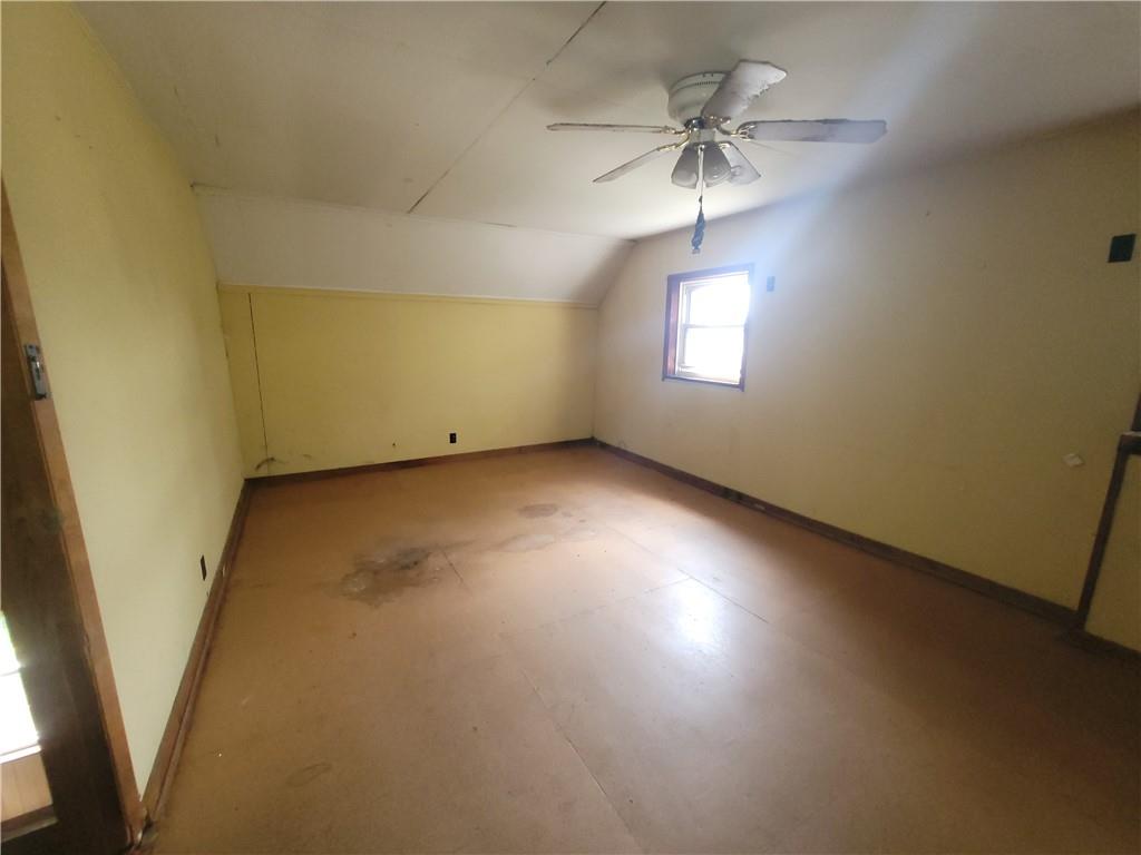 3013 Leechburg Road New Kensington, PA 15068 - Photo 9 of 28 an empty room with a ceiling fan and a window