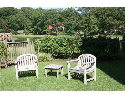 603 Steamboat Road, Unit 4 Greenwich, CT 06830 - Photo 3 of 14 a view of a chair and table in the garden