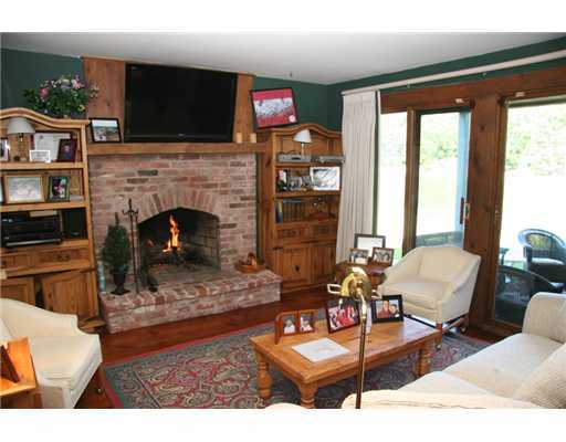 603 Steamboat Road, Unit 4 Greenwich, CT 06830 - Photo 4 of 14 a living room with furniture and a fireplace