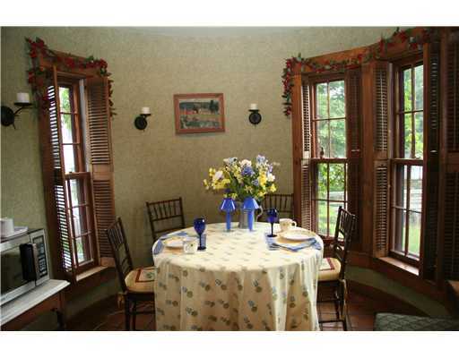 603 Steamboat Road, Unit 4 Greenwich, CT 06830 - Photo 6 of 14 a dining room with a table and chairs