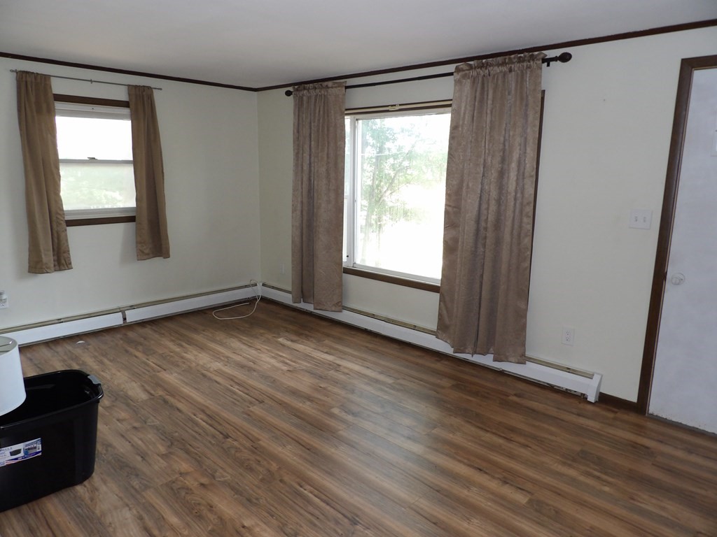 19 Kimball Road Amesbury, MA 01913 - Photo 12 of 26 an empty room with wooden floor and windows