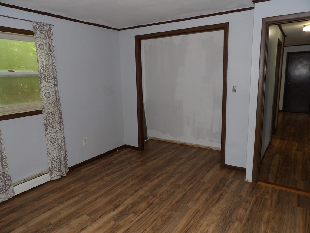 19 Kimball Road Amesbury, MA 01913 - Photo 18 of 26 a view of an empty room with wooden floor and a window