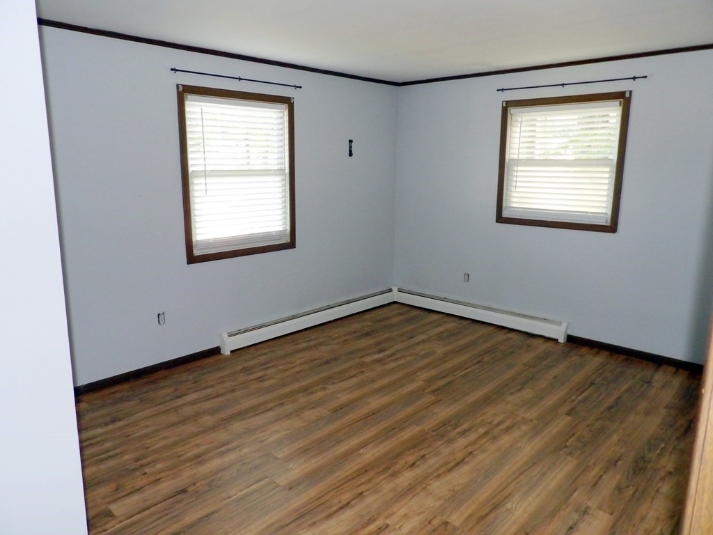 19 Kimball Road Amesbury, MA 01913 - Photo 19 of 26 an empty room with wooden floor and windows