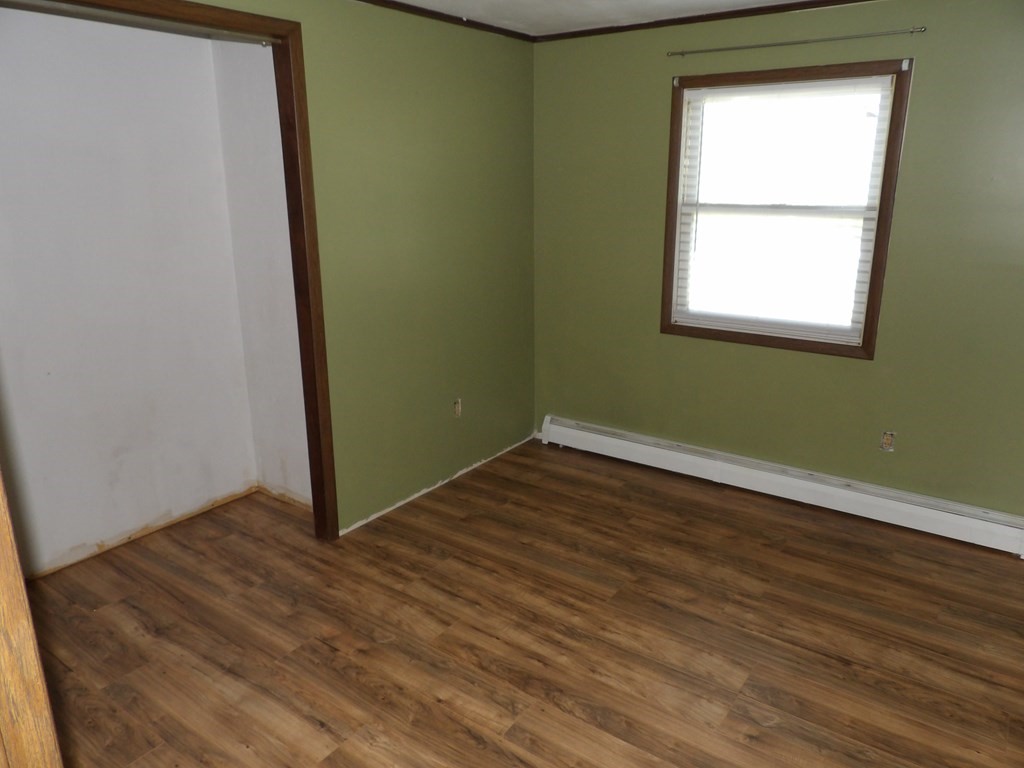 19 Kimball Road Amesbury, MA 01913 - Photo 21 of 26 an empty room with wooden floor and a window