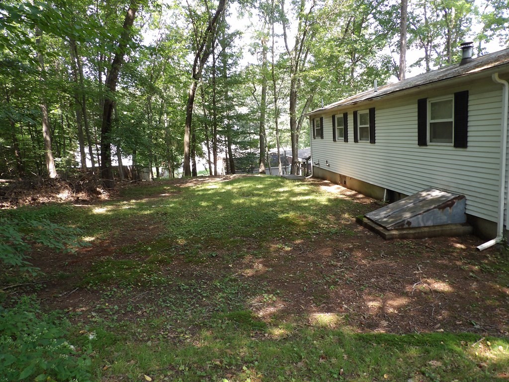19 Kimball Road Amesbury, MA 01913 - Photo 4 of 26 a backyard of a house with table and chairs