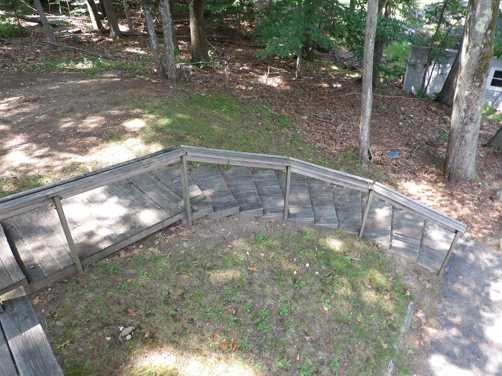 19 Kimball Road Amesbury, MA 01913 - Photo 8 of 26 a backyard of a house with lots of green space and outdoor seating
