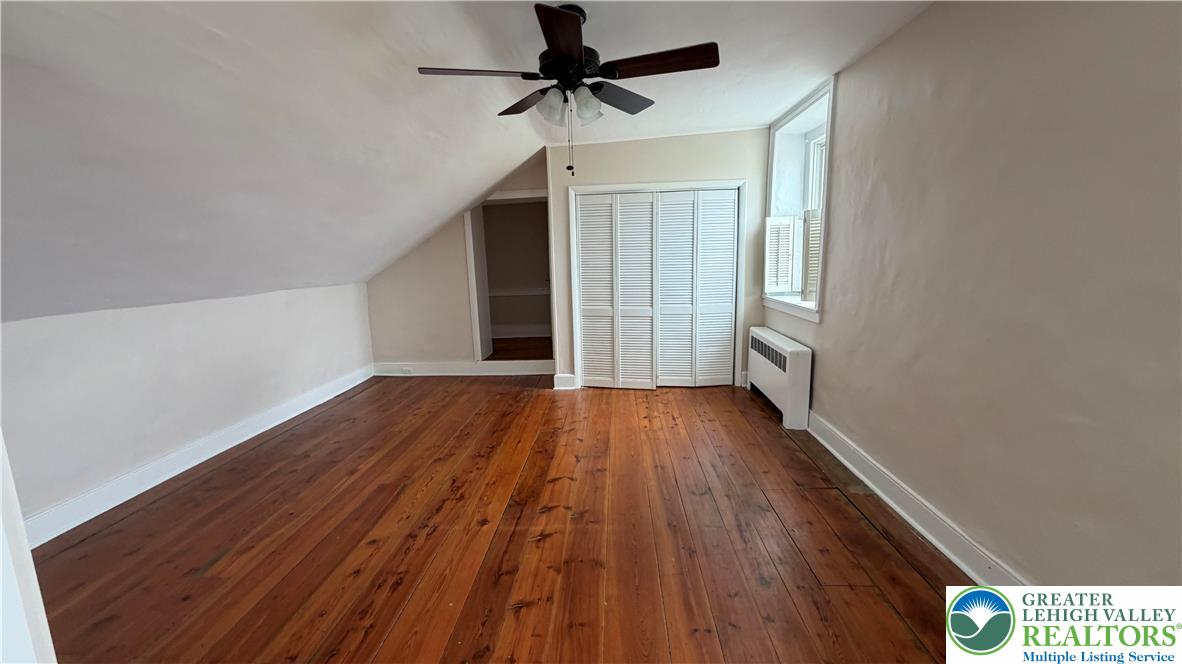 797 Main Street Tatamy, PA 18085 - Photo 16 of 41 a view of a room with wooden floor ceiling fan and window