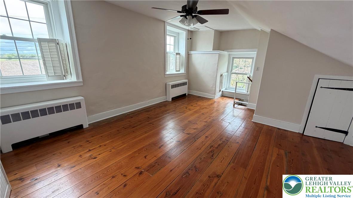 797 Main Street Tatamy, PA 18085 - Photo 17 of 41 an empty room with wooden floor and windows