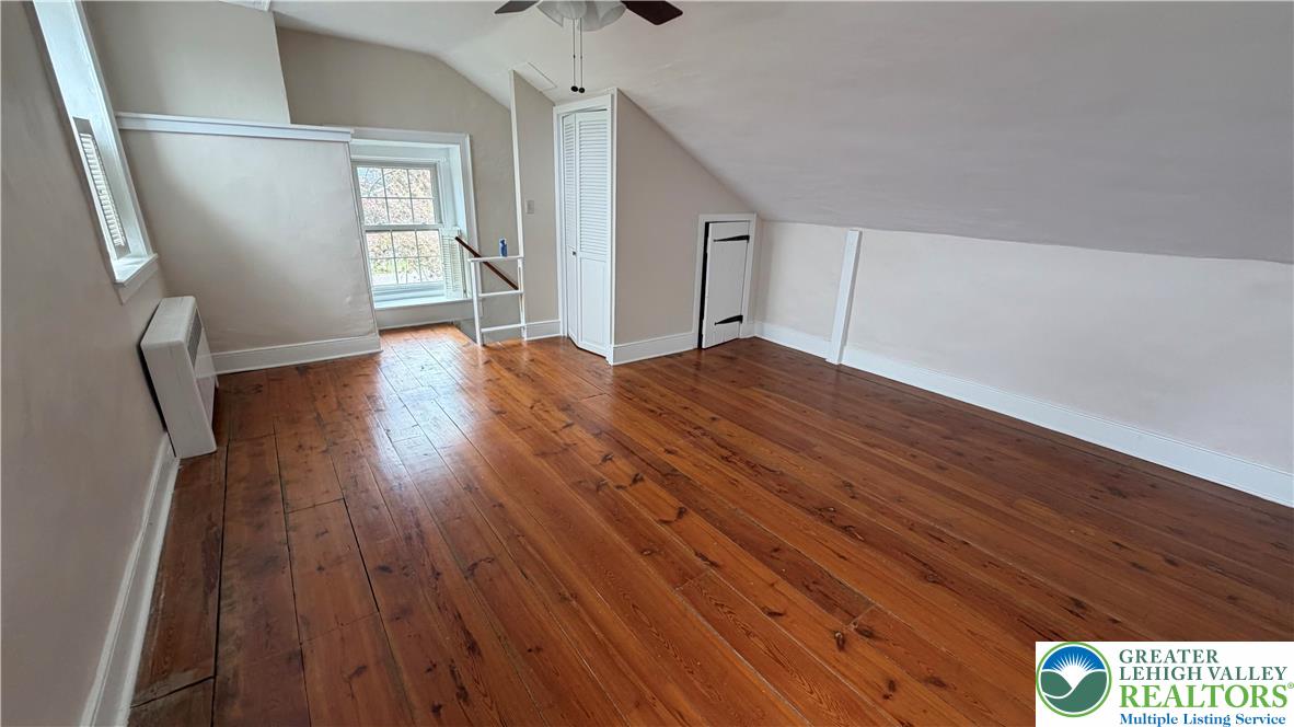 797 Main Street Tatamy, PA 18085 - Photo 19 of 41 a view of an empty room with wooden floor and a window