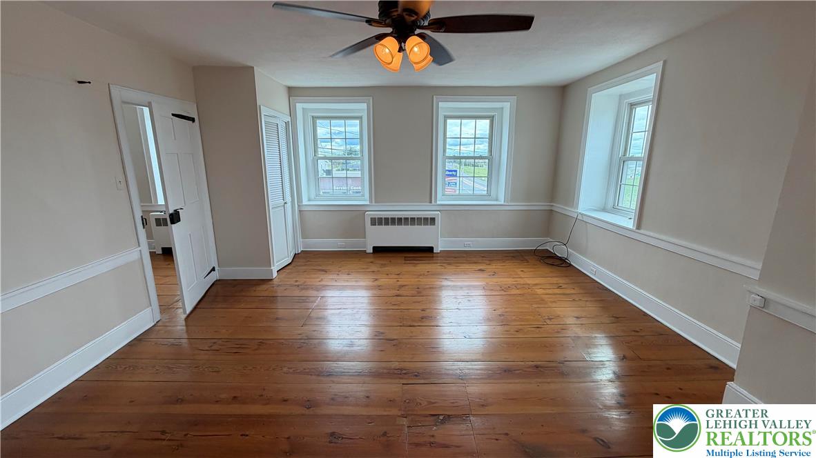 797 Main Street Tatamy, PA 18085 - Photo 21 of 41 a view of empty room with wooden floor and fan