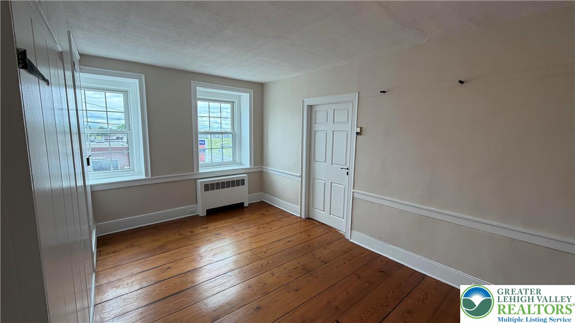 797 Main Street Tatamy, PA 18085 - Photo 27 of 41 a view of an empty room with wooden floor and a window
