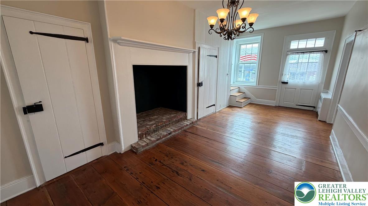 797 Main Street Tatamy, PA 18085 - Photo 30 of 41 a view of a livingroom with wooden floor and a fireplace