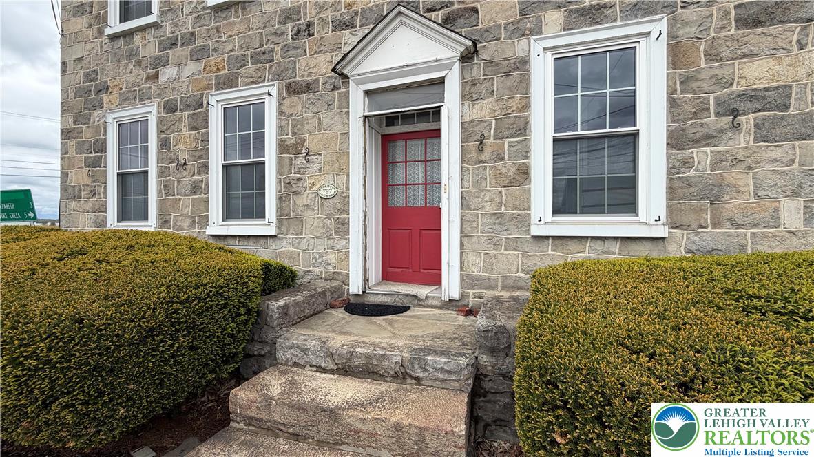 797 Main Street Tatamy, PA 18085 - Photo 4 of 41 a view of a brick house with a street