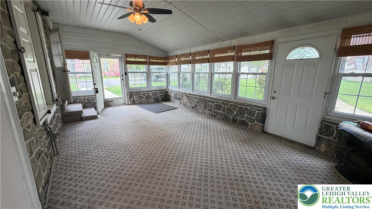 797 Main Street Tatamy, PA 18085 - Photo 41 of 41 a spacious bedroom with a large bed and a tv on table