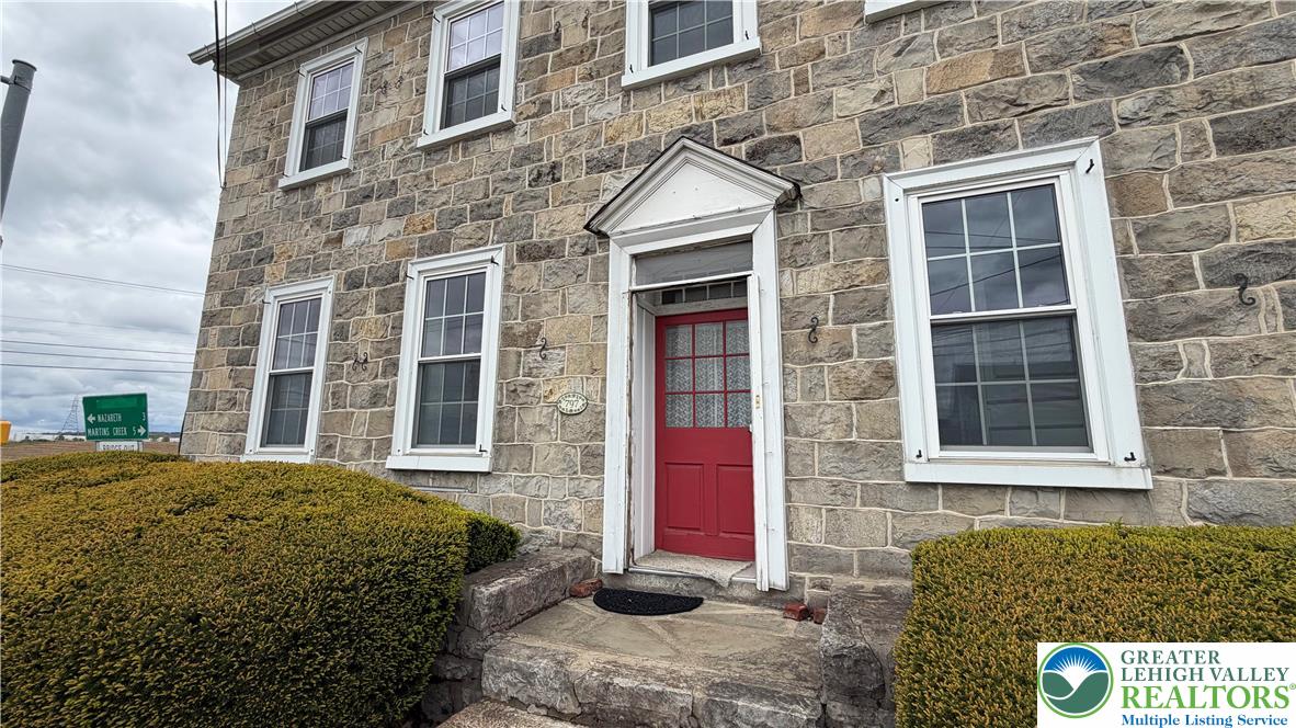 797 Main Street Tatamy, PA 18085 - Photo 5 of 41 a view of a brick building that has a lots of windows