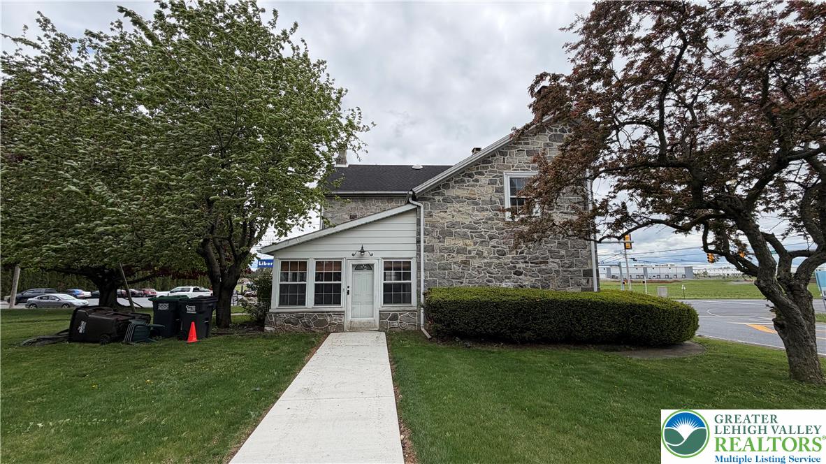797 Main Street Tatamy, PA 18085 - Photo 10 of 41 a front view of a house with a garden