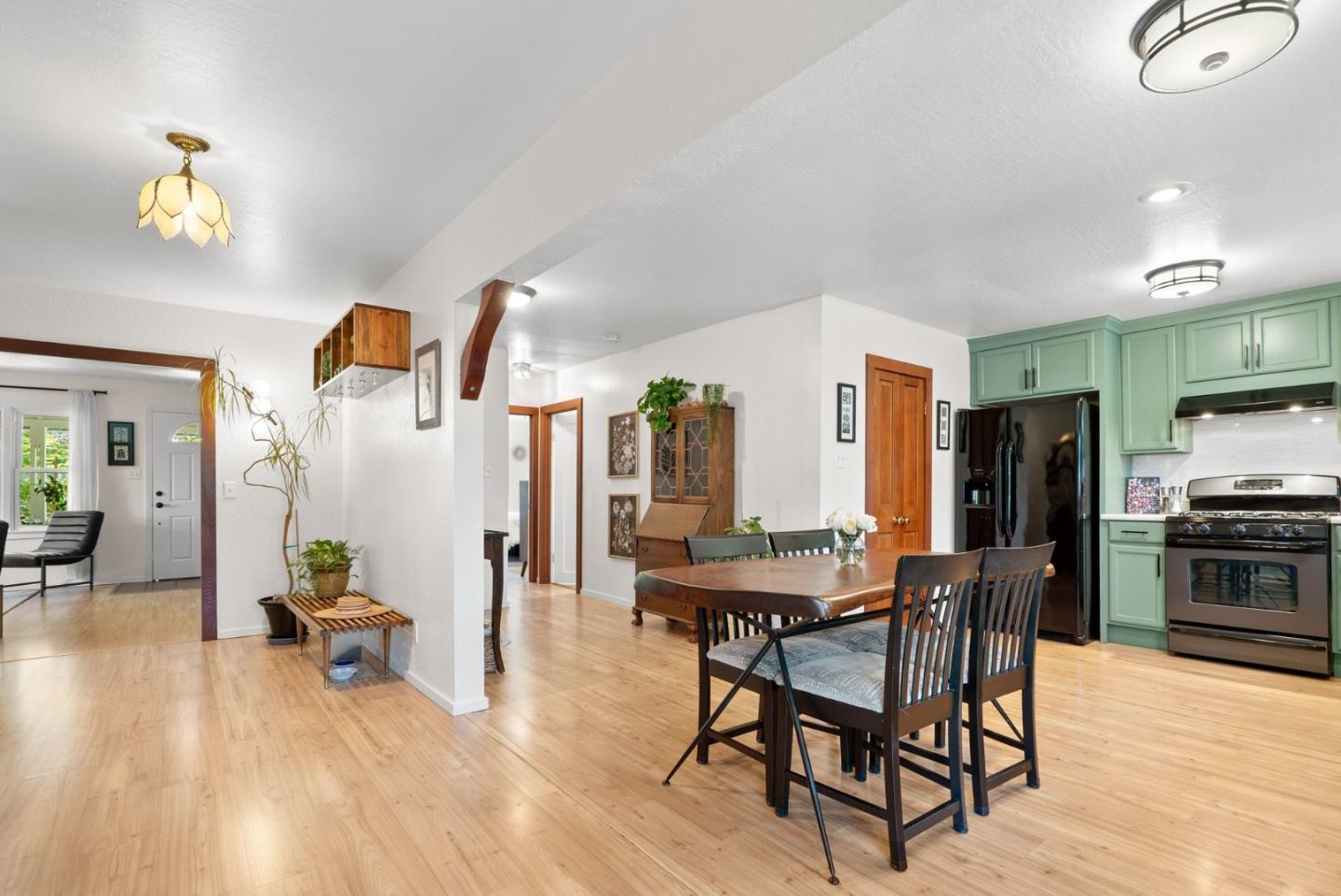 280 Main Street Ben Lomond, CA 95005 - Photo 12 of 47 a living room with furniture and a dining table with wooden floor