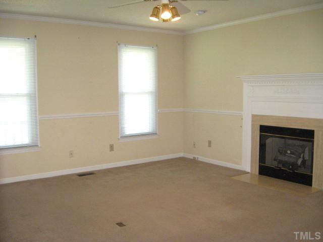 9500 Applewhite Road Wendell, NC 27591 - Photo 2 of 12 Great living room with chair rail & gas log fireplace Living Room