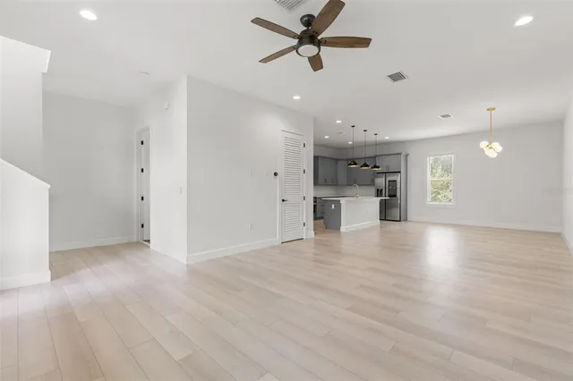 a view of a kitchen with a dishwasher and a refrigerator