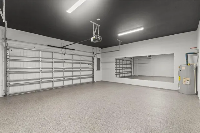 a kitchen with a sink a counter space appliances and cabinets
