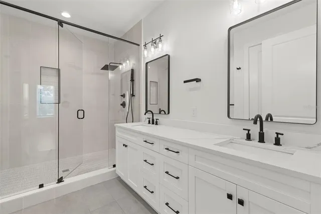 a bathroom with a shower and a sink