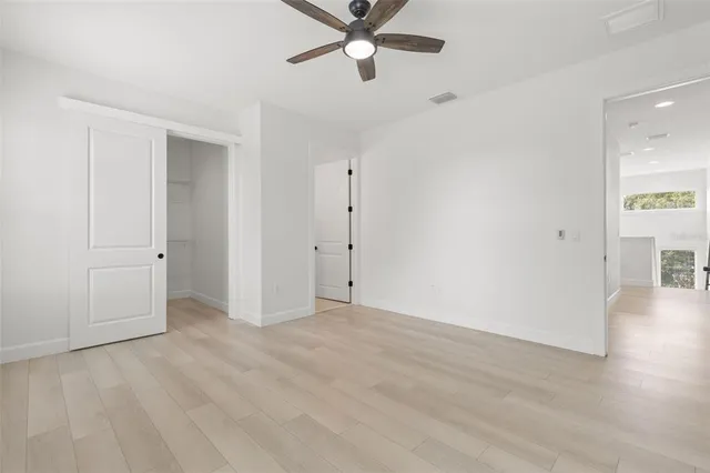a bathroom with a double vanity sink toilet and shower
