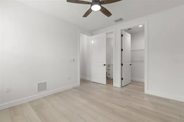 a bathroom with a toilet sink and a mirror