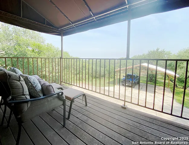 a balcony with wooden floor