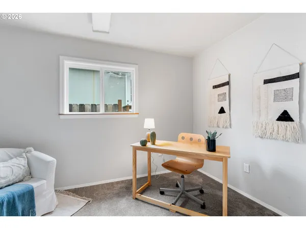 a kitchen with a sink and a washer dryer