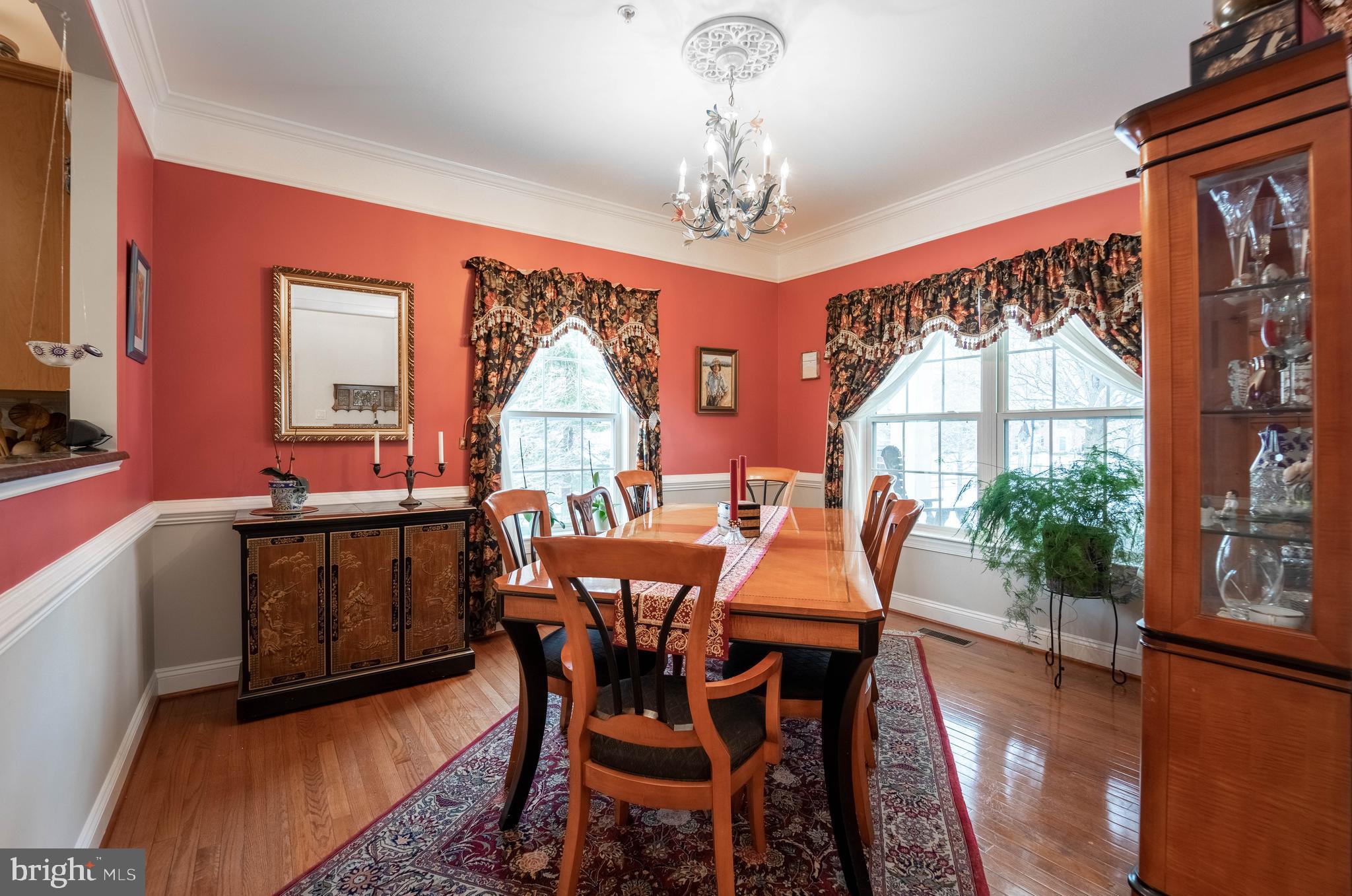 Formal Dining-room with 3 windows & hardwoods