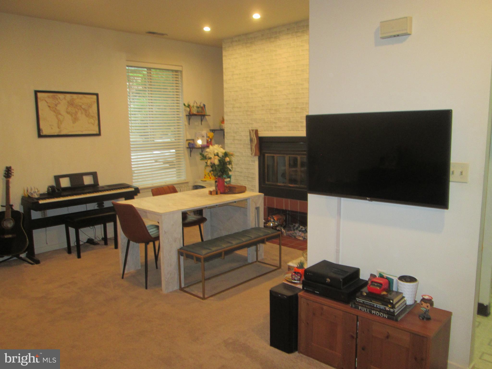 Delightful  living area, wide window and fireplace