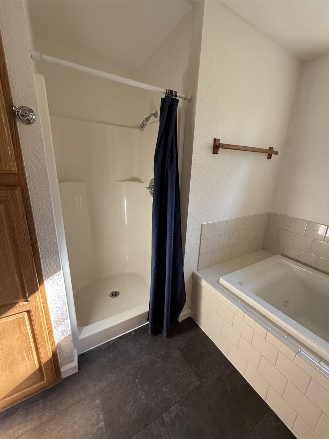 4881 Marshall Road Garden Valley, CA 95633 - Photo 14 of 25 a bathroom with a bathtub and a shower